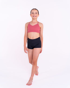 Dance studio lifestyle shot - girl in ribbed shorts practicing